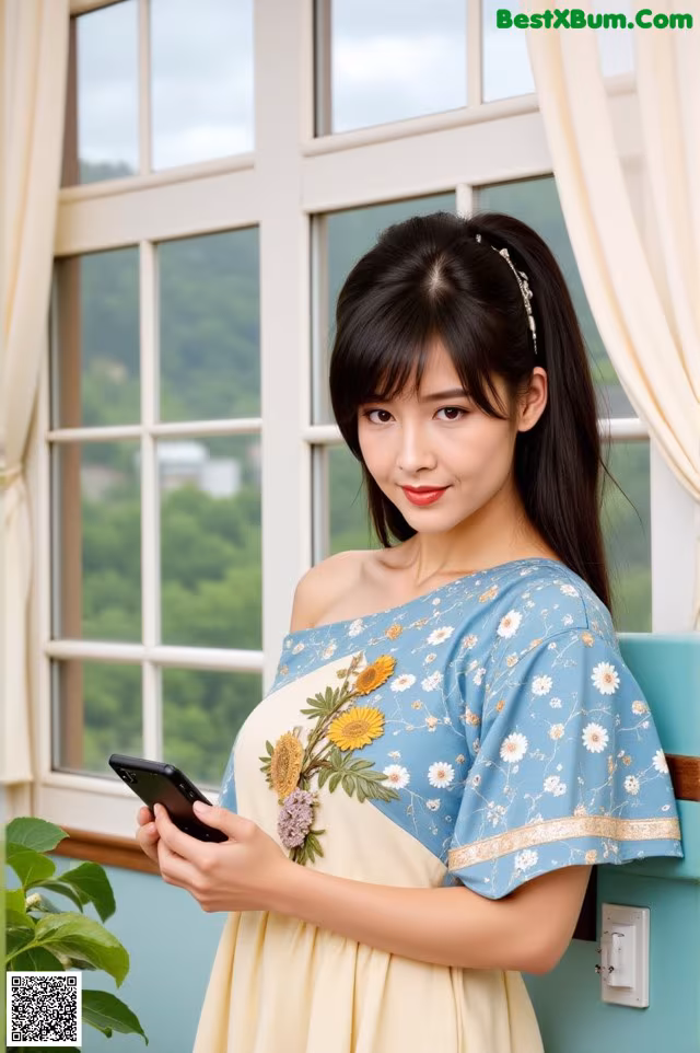 A woman in a yellow dress holding a cell phone.