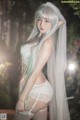 A woman with long white hair wearing a white lingerie.